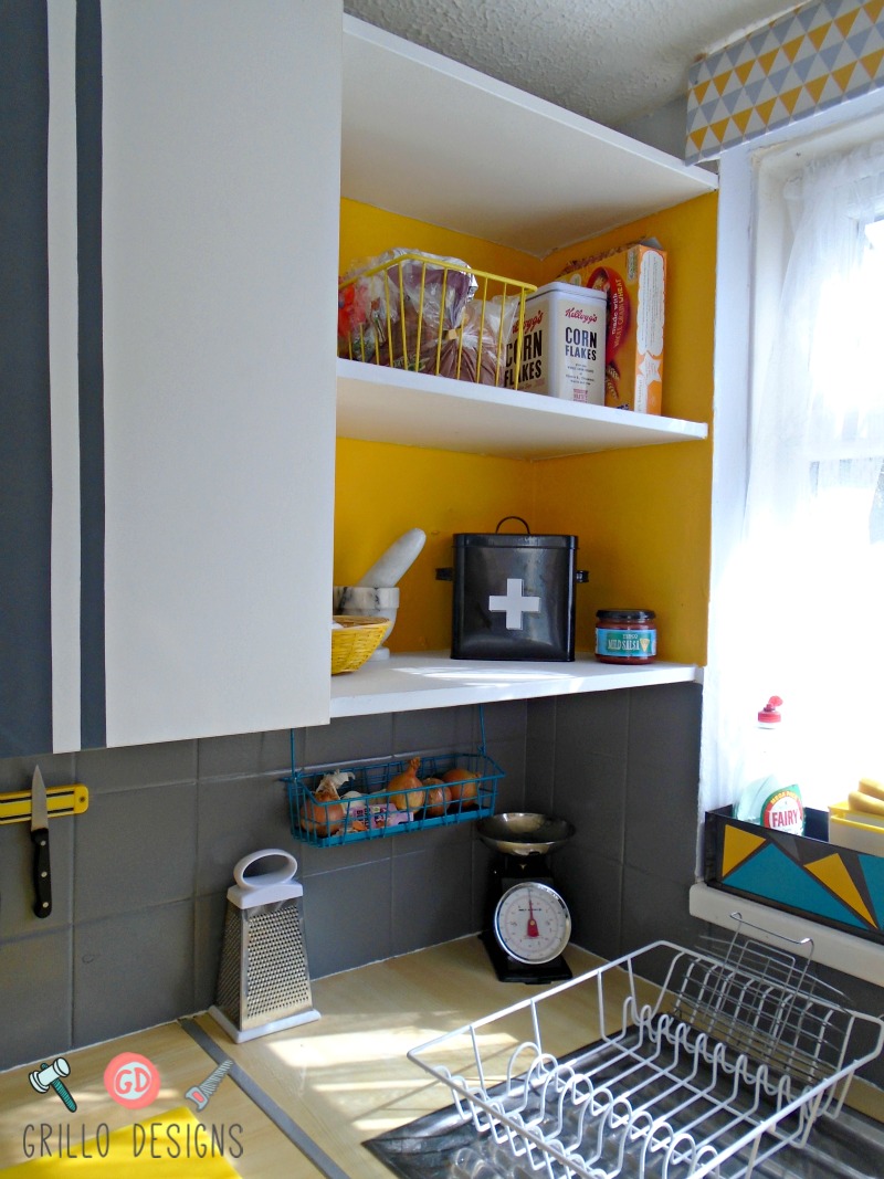 Open shelving, white with yellow on the back