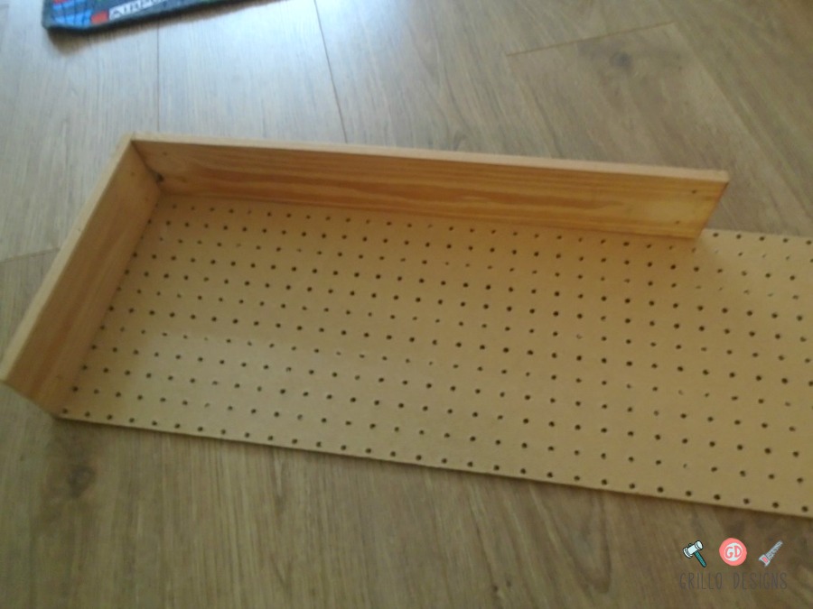 Securing the wood to the pegboard