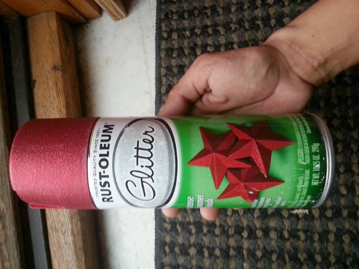 Close up of a can of red glitter spray paint