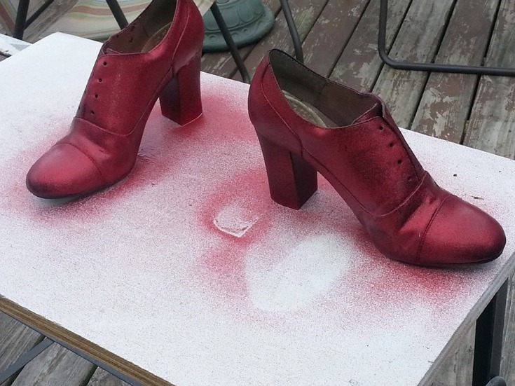 High heeled lace up shoes sprayed with red glitter spray paint