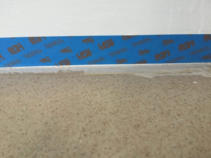 Use painters tape to tape the walls near the counter top edge