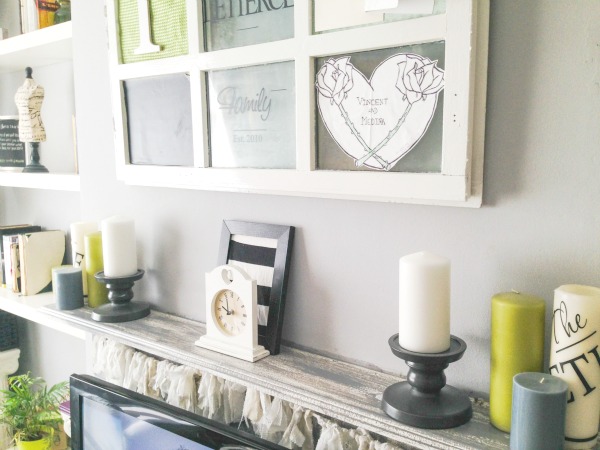 Living room with a splash of green - Our mantel topped with pops of green in the candles