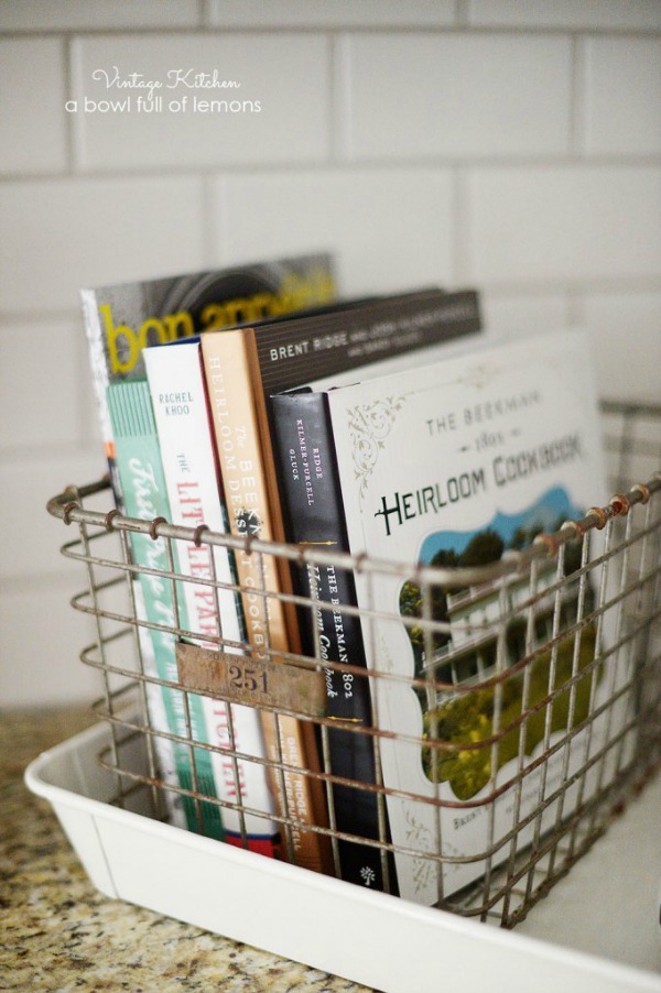 store cookbooks in vintage baskets to declutter kitchen counters via A bowl full of lemons / Grillo Designs www.grillo-designs.com