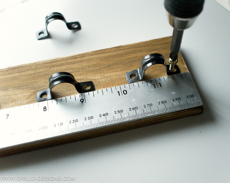screw in plumbing clips to make a diy utensil rack holder/ Grillo Designs www.grillo-designs.com