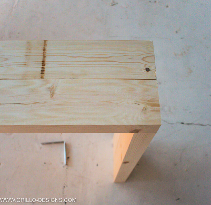 Place the top of the wood over the sides at a right angle
