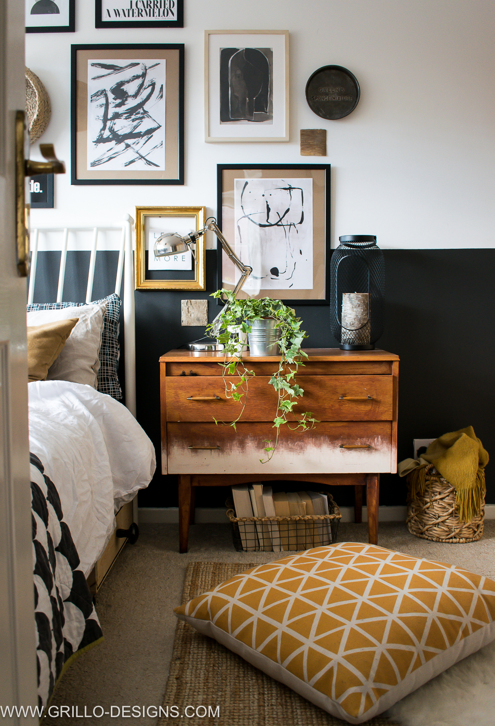 Gallery wall in bedroom featuring a yellow scandi floor cushion 