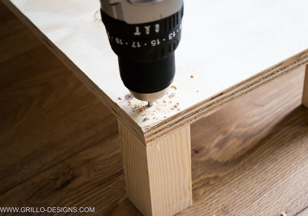 use a drill to pre-drill a hole into the wood plank and feets