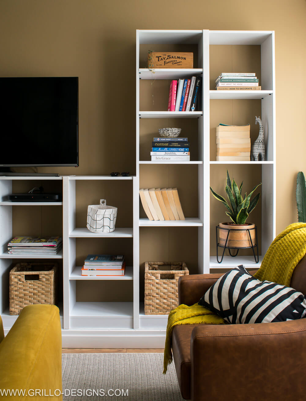Built in bookcase wall against a wall that has been painted Char latte by valspar 