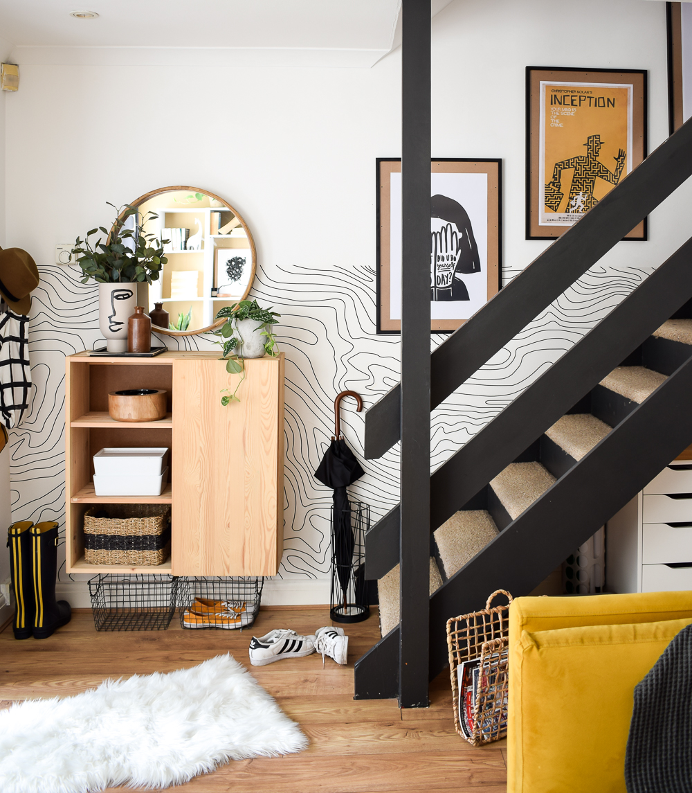 Final styled look at staircase gallery wall in the living room