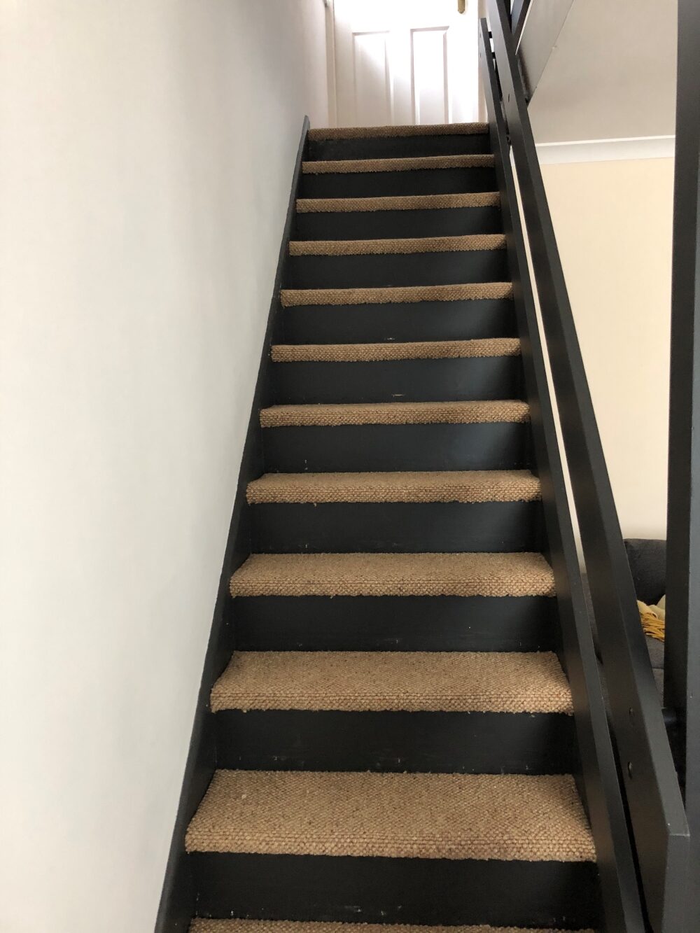 Black Painted stairs with carpet treads