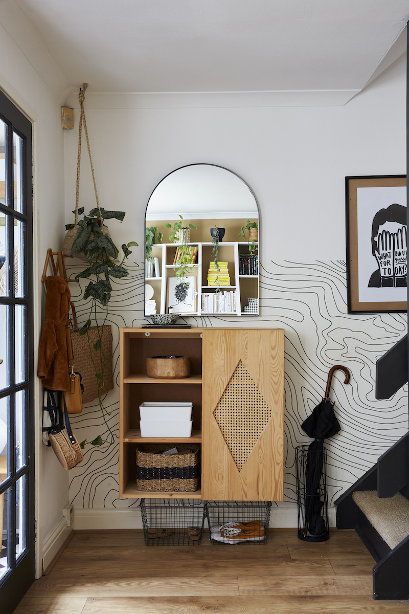 Entrance with Ikea Ivar hanging on wall with Topographic Contours Wallpaper, umbrella stand to the right, hanging plant to the left 