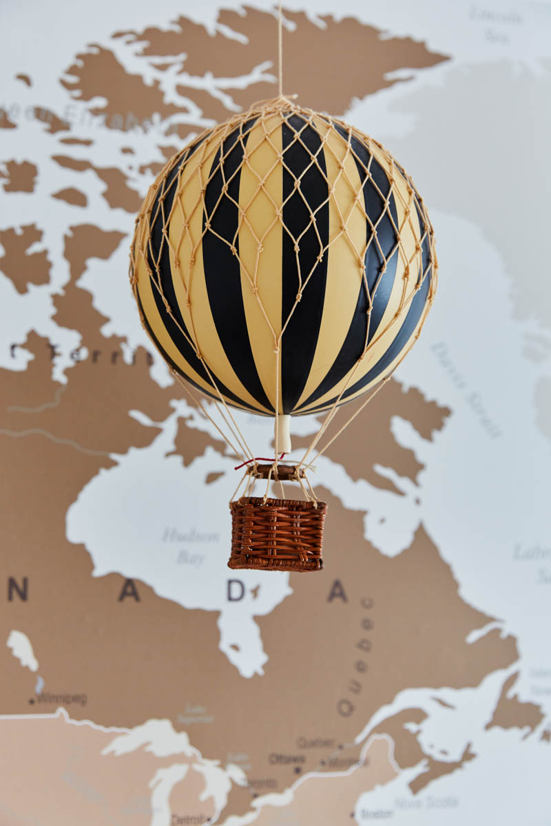 closeup of hot air ballon hanging from ceiling in travel themed boy's bedroom
