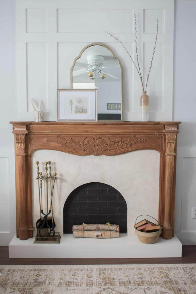 vintage wood mantle with black brick painted faux firebox 