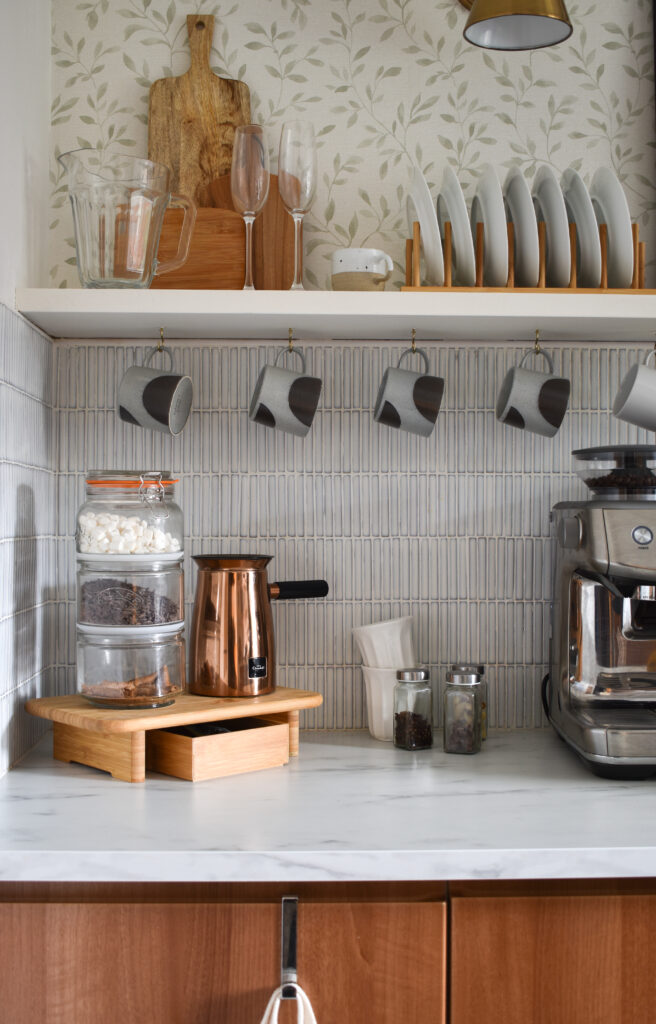 ikea stolthet used as a stand for a coffee/hot chocolate corner with the hotel chocolat velvetiser in copper in a white and wood kitchen